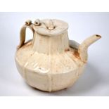 A Chinese Song style cream glazed teapot and cover