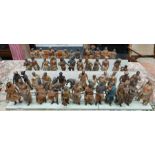 A collection of vintage Indian painted carved wood figures in a variety of traditional costume