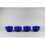 Four Chinese Peking blue glass bowls, late Qing or Republic