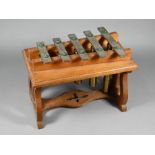 An Edwardian oak-framed xylophone dinner-gong