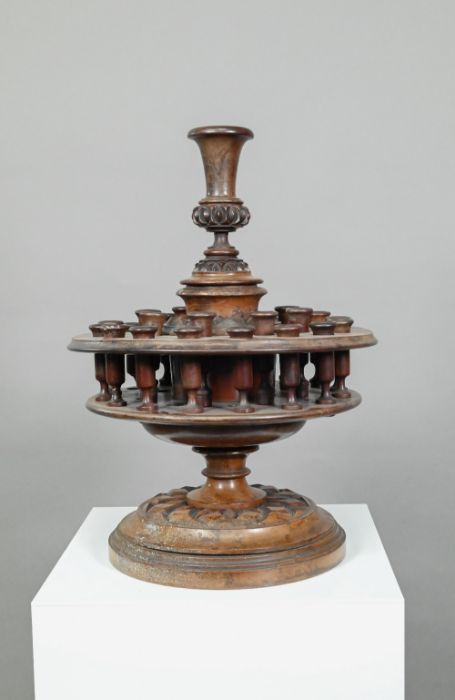 An antique carved and turned wood snuff or tobacco stand
