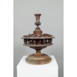 An antique carved and turned wood snuff or tobacco stand
