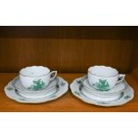 A Herend Apponyi Green double-trio of tea-cup, saucer and plate (6)