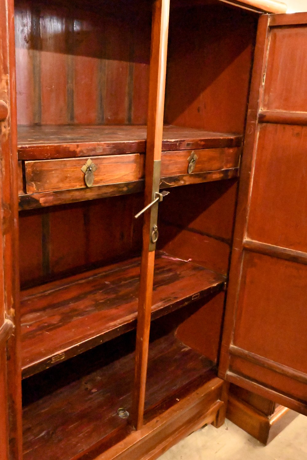 A Chinese hardwood and brass mounted two door cupboard, the interior fitted with shelves and two - Image 3 of 4