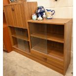 A mid-century step bookcase with sliding glass doors, fall front cupboard and single drawer, 120