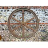 A vintage cast iron spiked wheel, 91 cm dia.