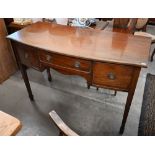 An Edwardian mahogany bowfront sideboard with three drawers, square tapering supports with spade