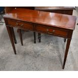 A reproduction mahogany two drawer hall table on square tapering supports, 92 cm wide x 31 cm deep x