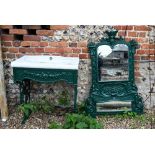 An old Victorian style cast iron mirror backed vanity stand with inset sink