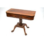 A Victorian mahogany tea table, the fold over top over a drawer, raised on acanthus moulded