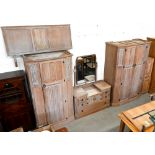 A 'Crown Ay' limed oak bedroom suite with carved gothic arch and linenfold panels comprising