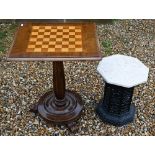 A cast iron Victorian style greenhouse heater body with veined marble travertine top, to/w a chess