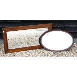 A bevelled rectangular wall mirror in stained hardwood frame 130 x 65 cm to/w a bevelled oval mirror