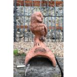 A small cast terracotta owl ridge tile