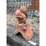 A small cast terracotta squirrel ridge tile