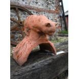 A small cast terracotta cat ridge tile