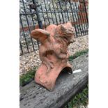 A small cast terracotta dragon ridge tile