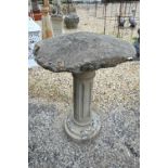 A staddle stone cap on a stonecrete column to/with a short staddlestone and cap (2)