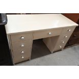 Cream painted nine drawer dressing table, 126 cm wide x 55 cm deep x 76 cm high