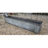 Large galvanized rivetted trough, 244 x 48 x 42 cm h
