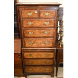 A Georgian style mahogany and walnut chest on chest, with two short over six long drawers with baize