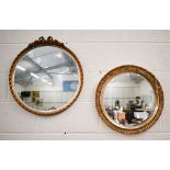 Two bevelled circular wall mirrors in decorative gilt frames (2)