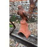 A cast terracotta hawk ridge tile