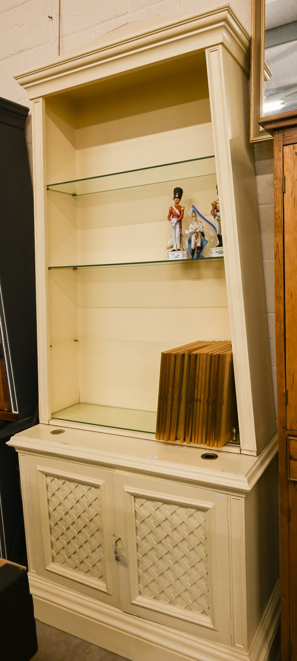 A large cream painted display cabinet/dresser with cream mouldings, the tapering open top section