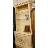 A large cream painted display cabinet/dresser with cream mouldings, the tapering open top section