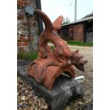 A large cast terracotta dragon ridge tile (chipped)