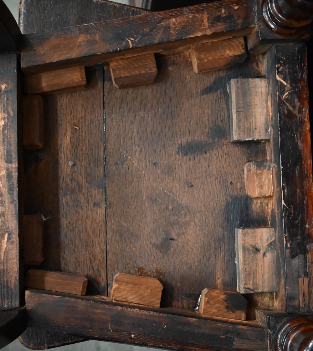 A pair of Victorian armorial carved oak hall chairs with panelled seats and turned front legs (2) - Image 4 of 4