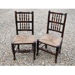 A set of five antique spindle back rope seat side chairs, to/w a similar carver chair - all a/f (6)