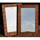 A pair of rectangular modern wall mirrors in hardwood frames with studded decoration, 91 cm x 60