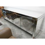 An Italian Porada Empire mirrored sideboard designed by Gino Carrollo with four concave push-to-open