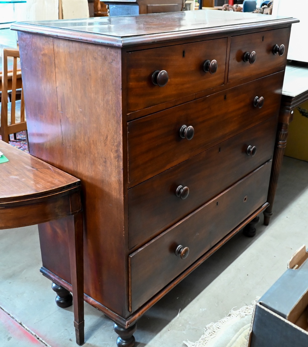 A large Victorian mahogany chest of two short over three long drawers with turned handles (one