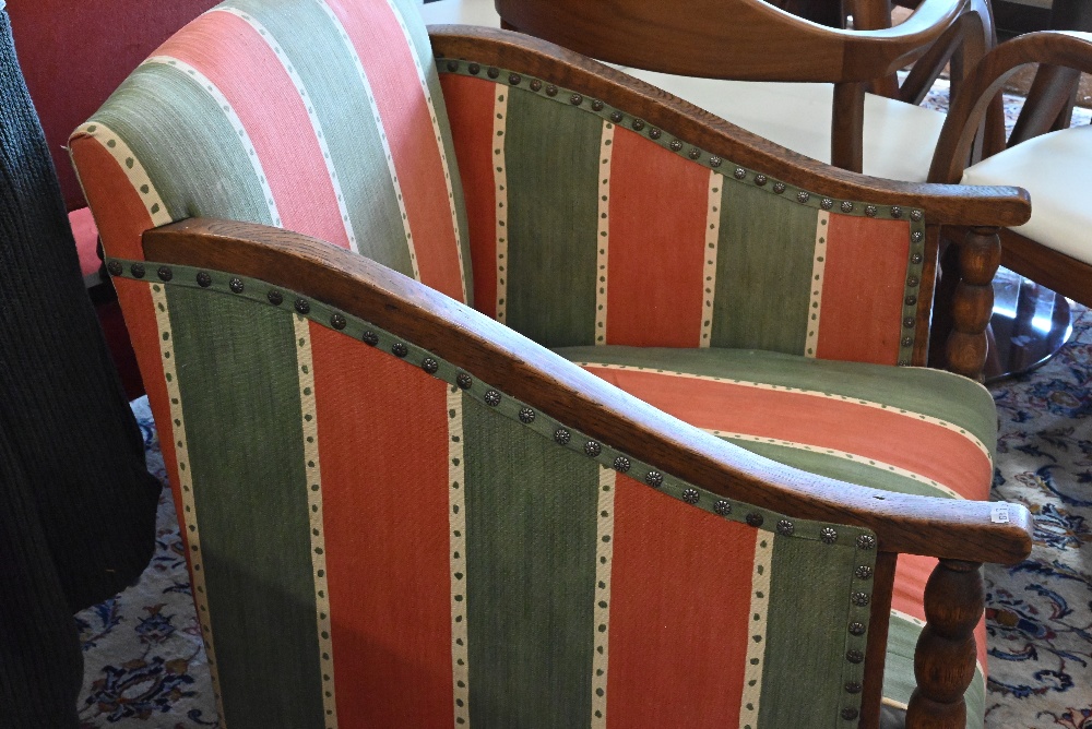 An early 20th century oak framed armchair with green and red striped fabric uphostery - Image 3 of 3