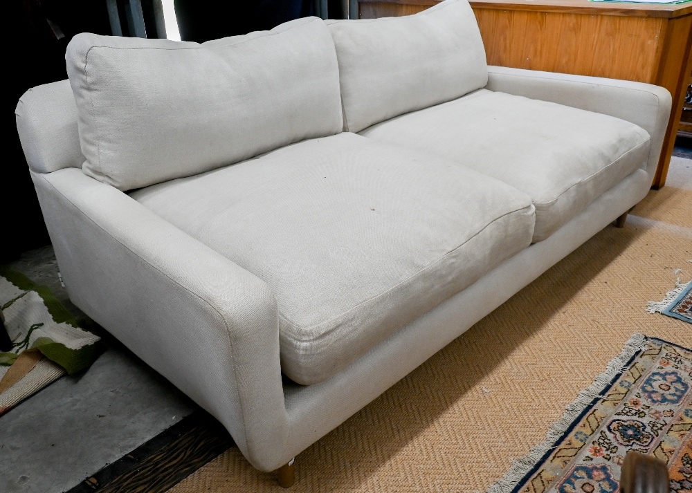 A Loaf Banoffee sofa, cream woven linen upholstery and turned light oak tapering legs, 210 cm w x - Image 2 of 4