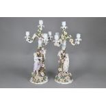 A pair of Sitzendorf porcelain floral-encrusted candelabra with detachable three branch tops, the