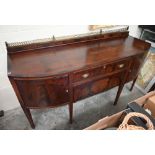 Edwardian mahogany and crossbanded bowfront large sideboard with brass gallery back above two