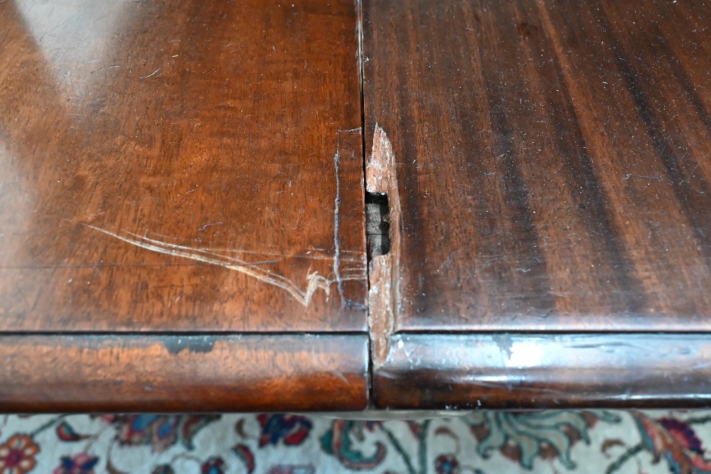 A 19th century mahogany extending dining table, the rounded rectangular top in three sections on - Image 5 of 5