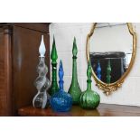 Five various coloured glass flasks with steeple stoppers, 58-36 cm