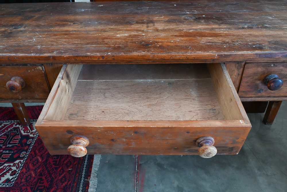 A provincial stained pine dresser base with three drawers and turned handles raised on square - Image 3 of 3