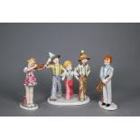 A Goldscheider with Myott Son & Co. pottery group of three boys striding, 23 cm high, to/w two other