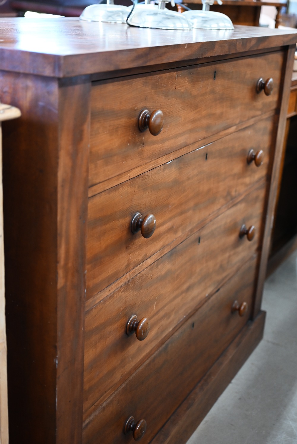 A large Victorian mahogany chest of four long graduating drawers with turned handles, raised on - Image 2 of 3