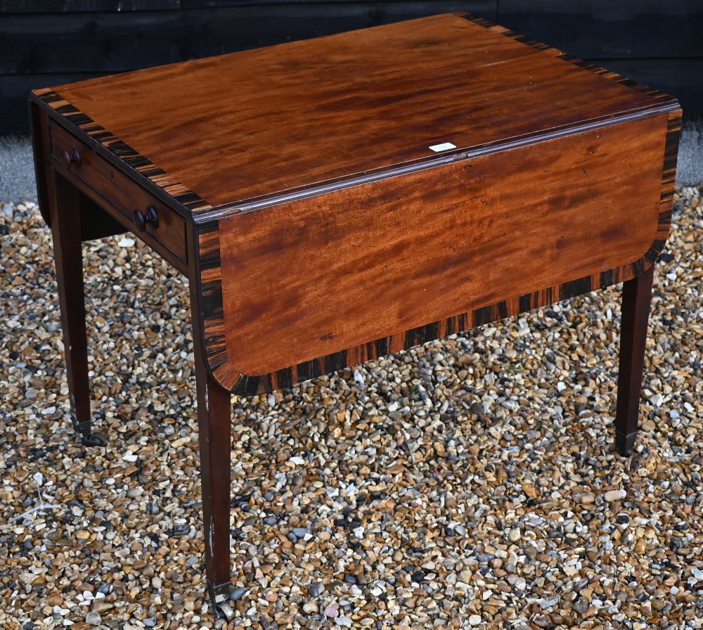 A 19th century two-drawer mahogany Pembroke table with coromandel cross-banding, drop leaf top