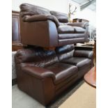 A brown leather two seater sofa, 180 cm w x 95 cm d x 95 cm h, to/w a matching three seater sofa,
