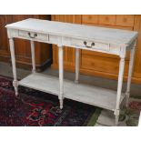 A narrow two-drawer hall table with turned supports and open under-tier, grey limed washed finish,