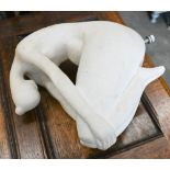 A modern abstract white fibreglass sculpture of a seated female nude, without base, 33 cm high