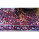 A fine antique Persian hand-made Bidjar rug, the wine-red ground centred by a medallion, 274 cm x