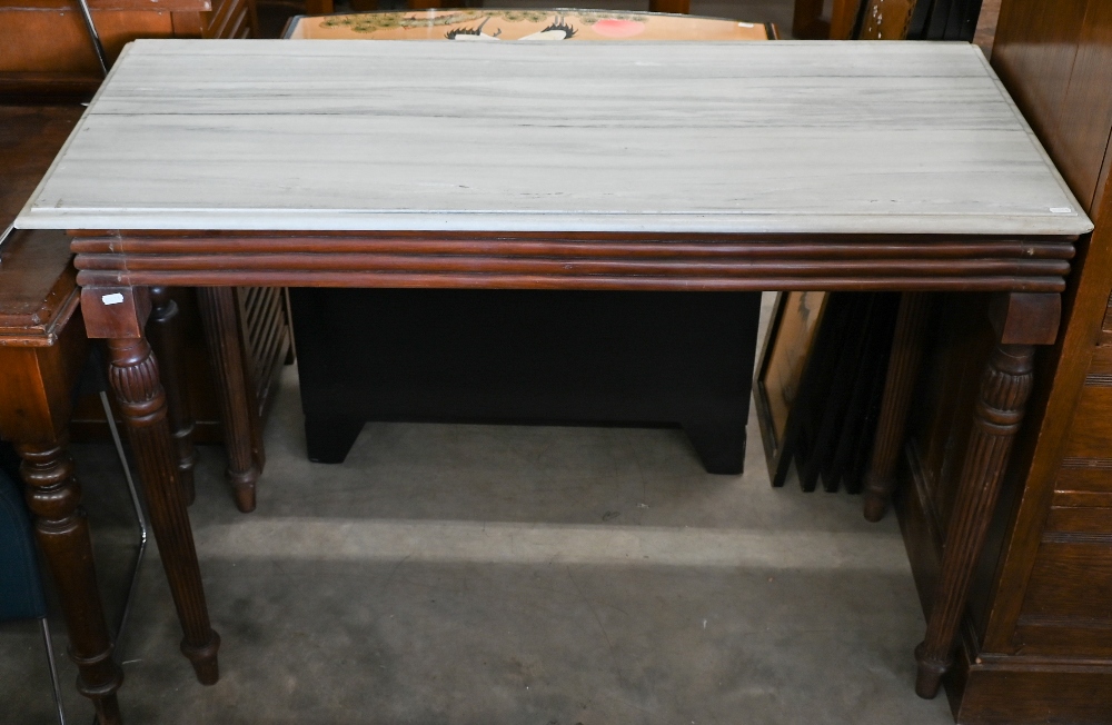 A marble top console table on mahogany base with turned and reeded supports, 122 cm wide x 51 cm